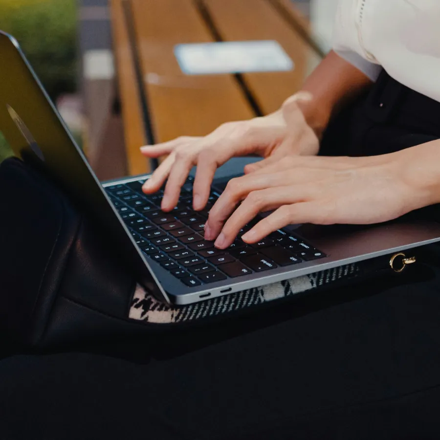 An operator working on a laptop outdoors